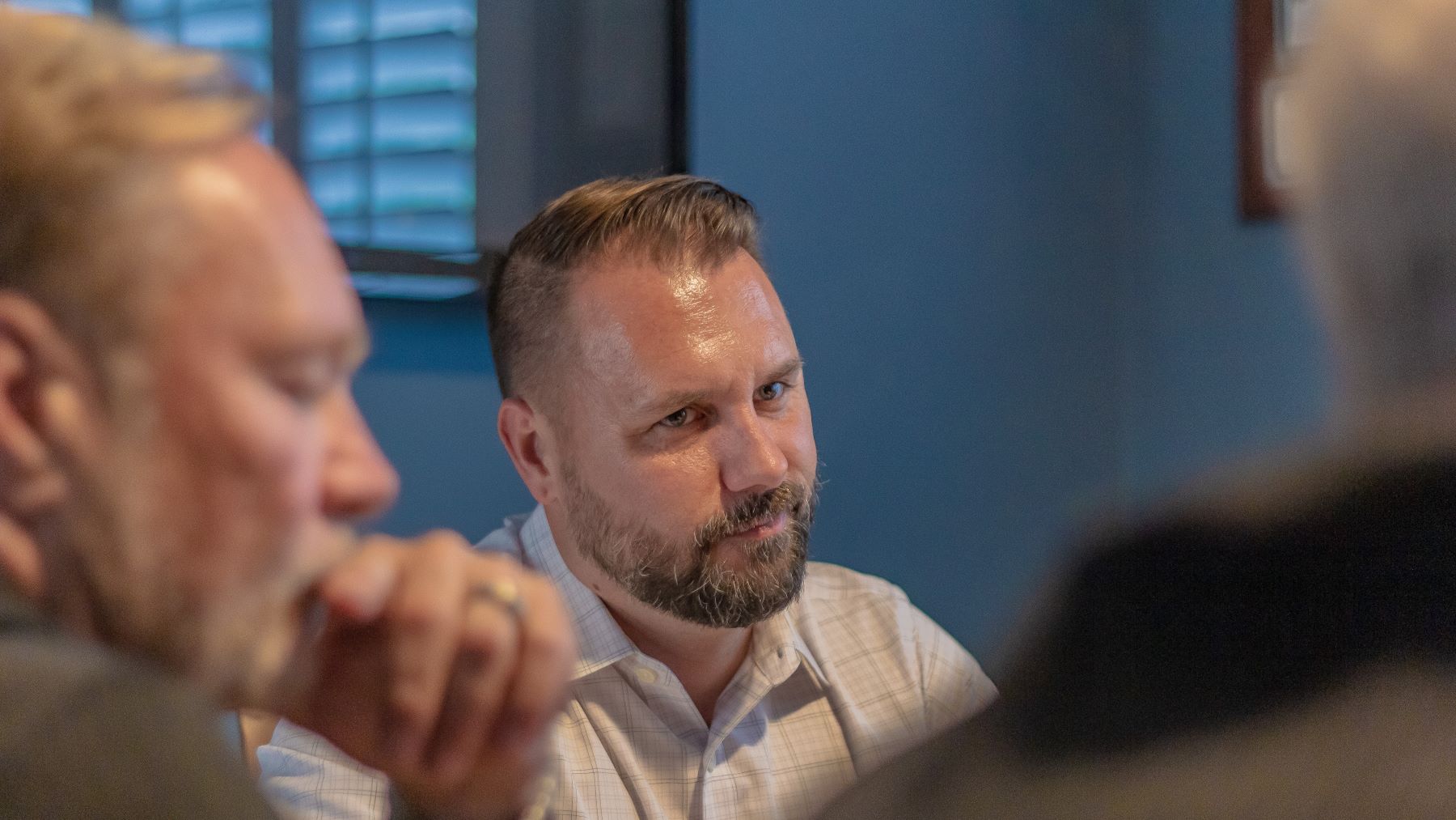 Chad Newberry listening to a client during a meeting