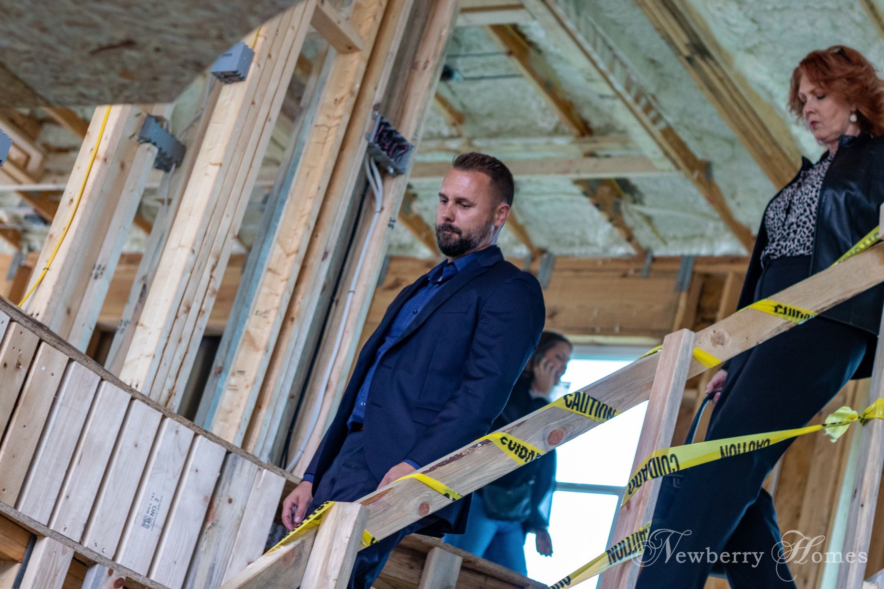 Chad Newberry tours a custom home build during the wood frame stage of the project