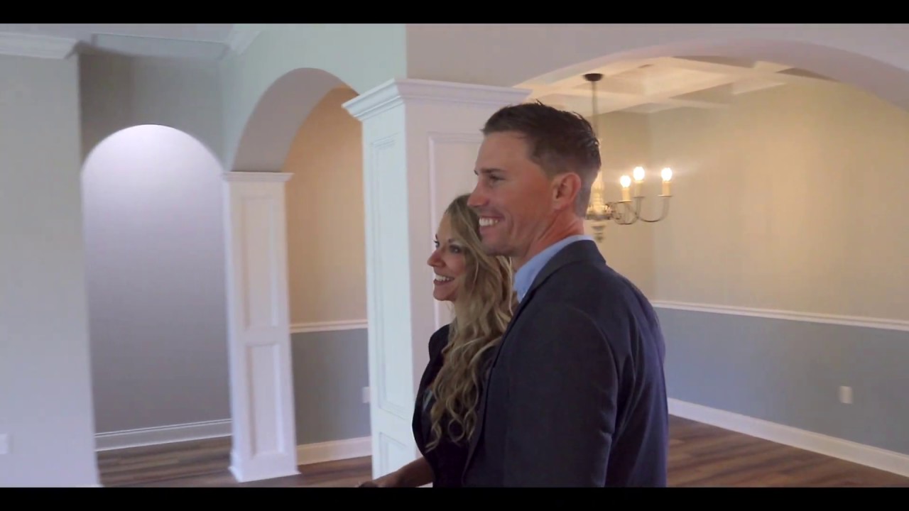 professional couple tours home for sale video image